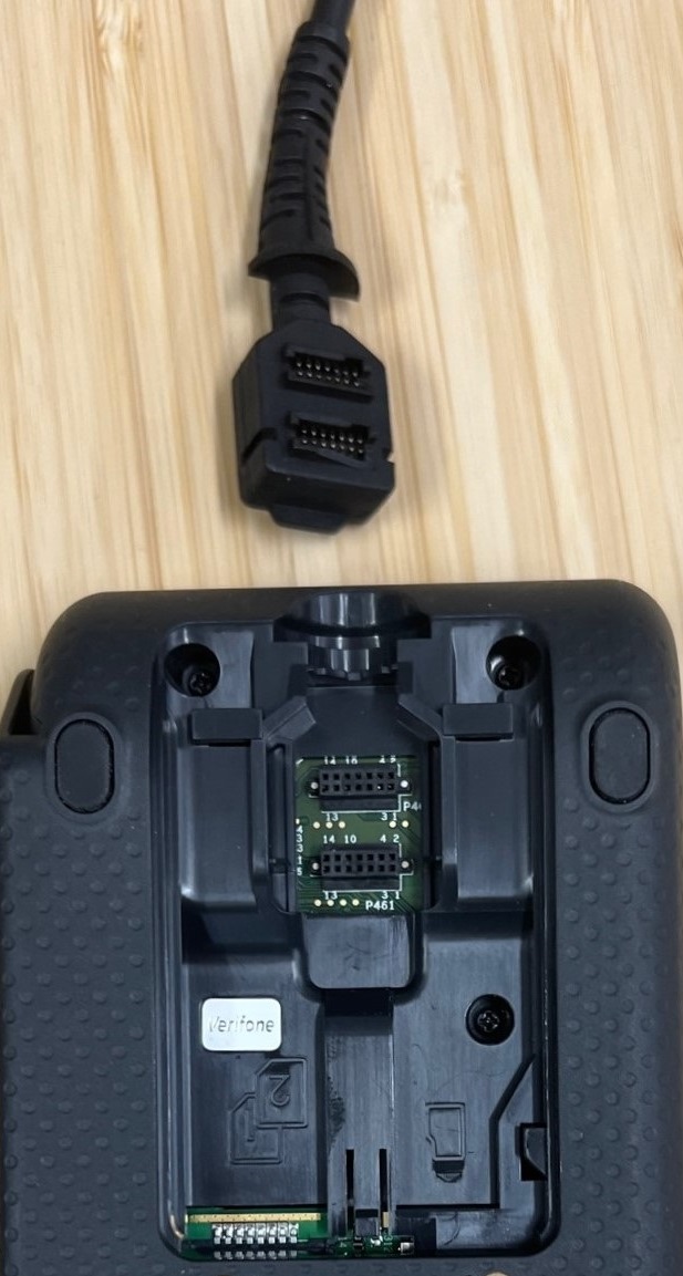the rear of a p400 pin pad showing where the power and usb cable plug in