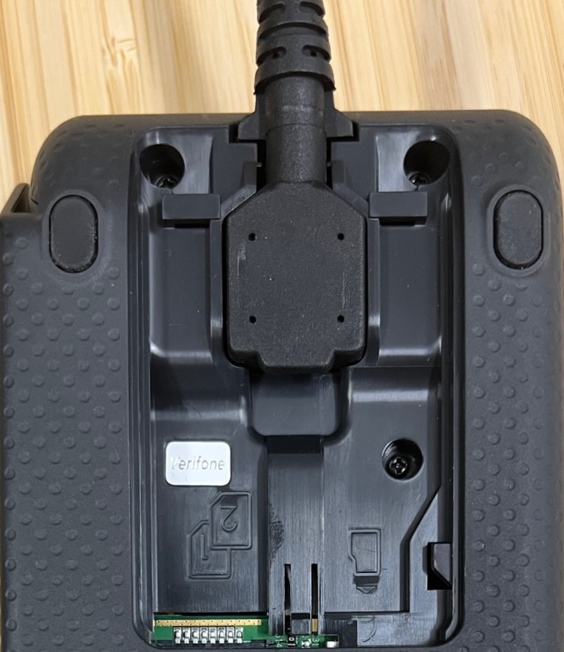 the rear of a p400 pin pad showing connected cable